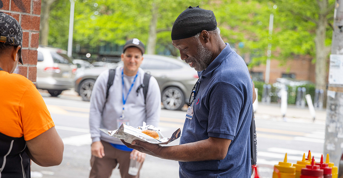 Andre stops for a bite to eat after a busy morning of checking in with the some of the neighborhood’s most vulnerable.
