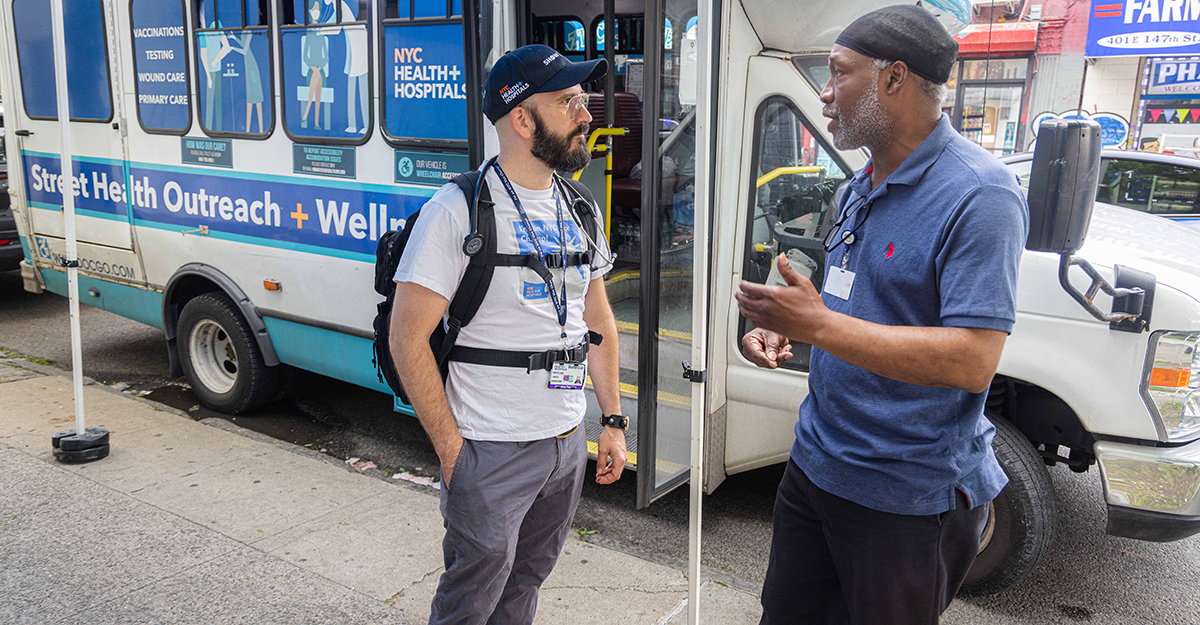 Andre speaks with a member of the medical team who offers consultations to individuals in the community experiencing homelessness. Our S.H.O.W. mobile units have facilitated approximately 28,000 medical consultations with specialists, RNs and social workers, including wound care and routine wellness checks across New York City.