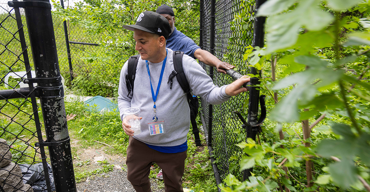 While many care providers work in traditional spaces like hospitals, clinics, nursing homes and residential settings, Jose and Andre tread paths that many of us would never dare take. Here, they make their way to a homeless encampment adjacent to the 138th Street bridge for a wellness check. (1/4)