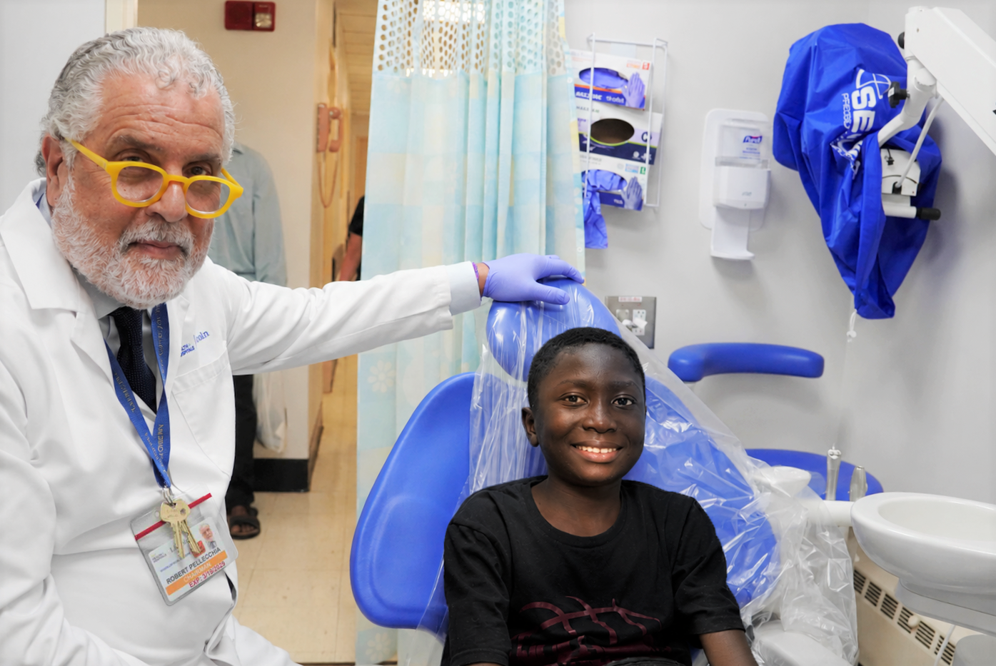 Dr. Robert Pellecchia with patient Ousman Ceesay at his post-op visit