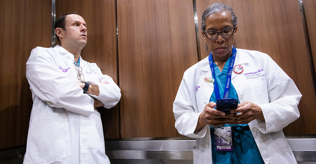 Riding between floors, Dr. McLaurin is on the move, on call and always prepared.