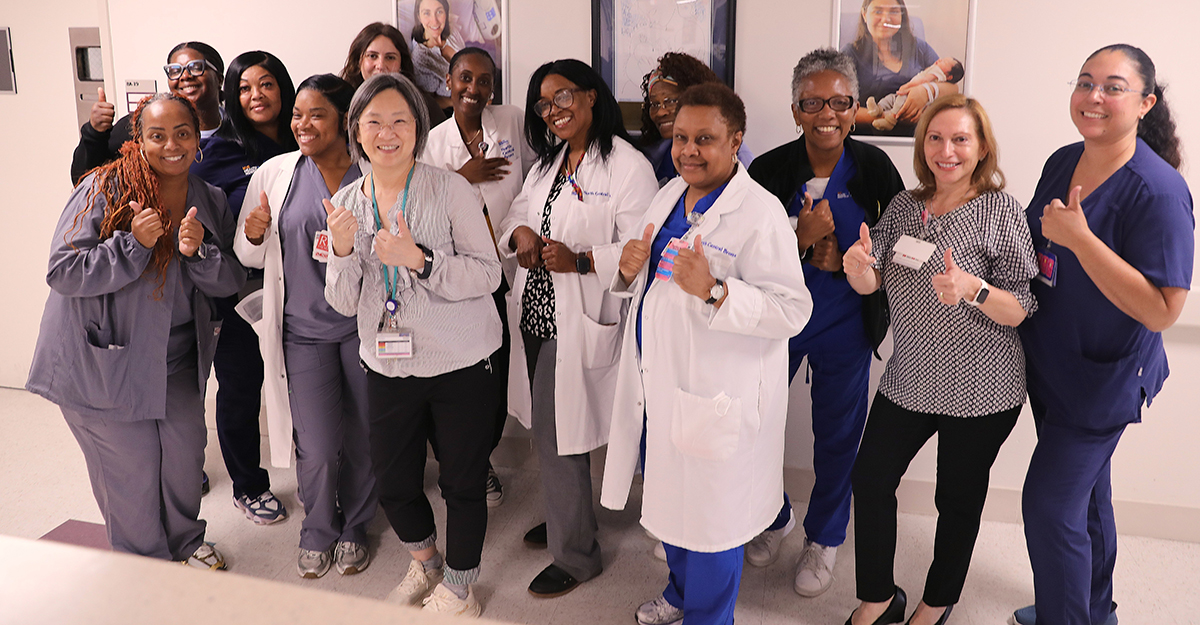 Labor and delivery team members celebrate their re-designation in place until the 2032 review.