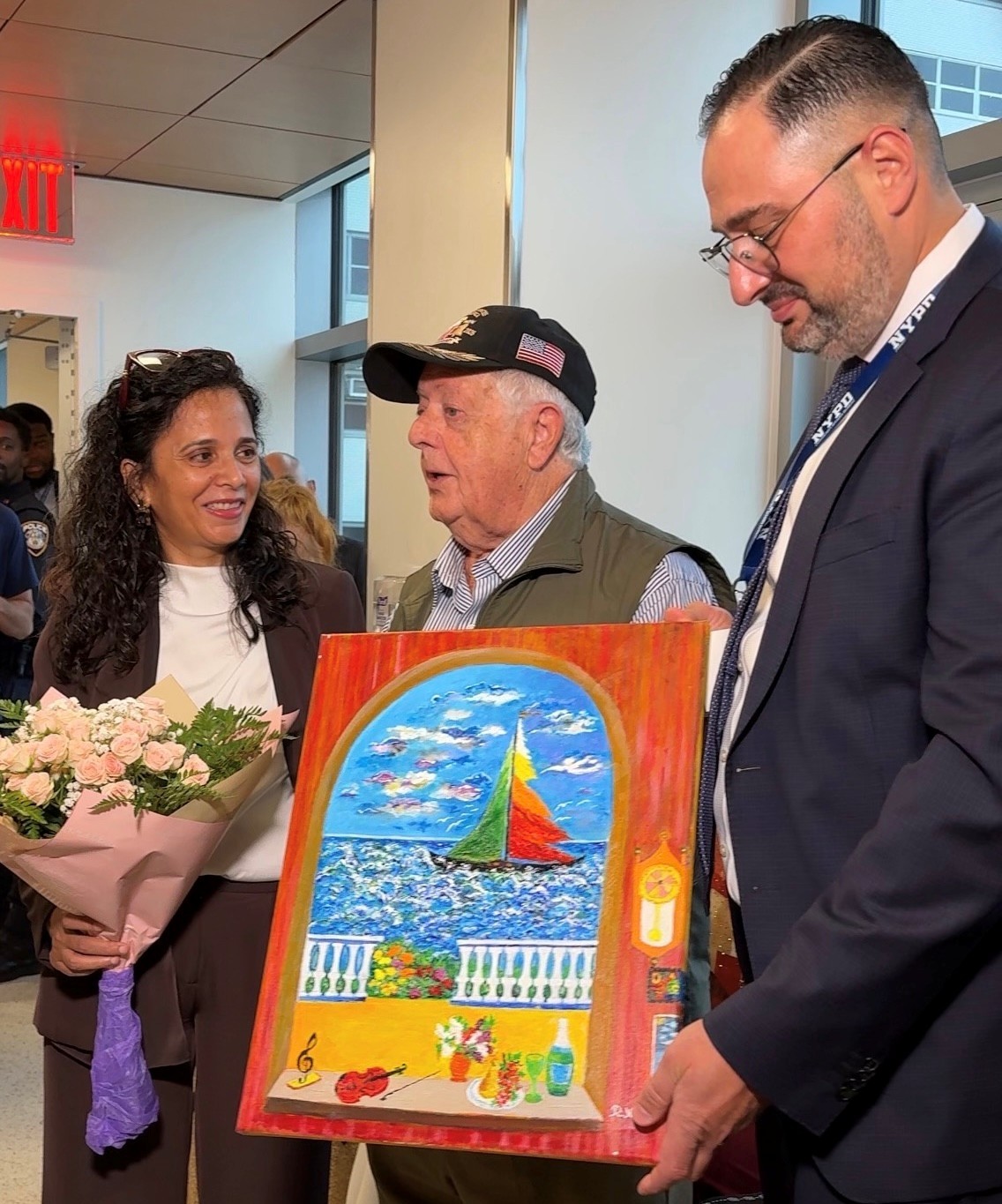 Manjinder Kaur, CEO of South Brooklyn Health is presented with a gift from Alex Zhorov, Chairman and President of Be Proud Inc. of Brooklyn, a painting by artist Roman Khrapunskiy honoring the hospitals doctors and staff.
