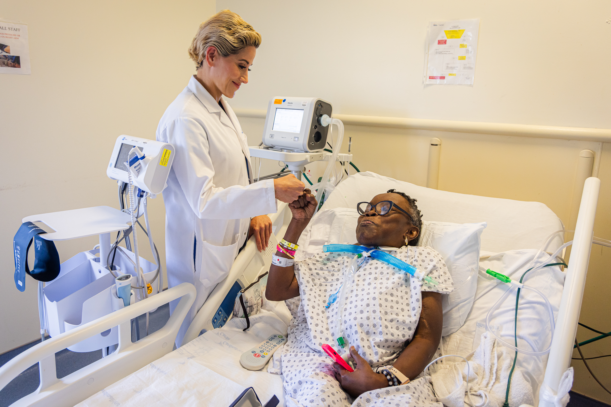 Carter LTACH Patient Lisa McNamee and Clinical Director Dr. Jamie Baux-Johnson celebrate their ventilator weaning success with a classic fist bump.