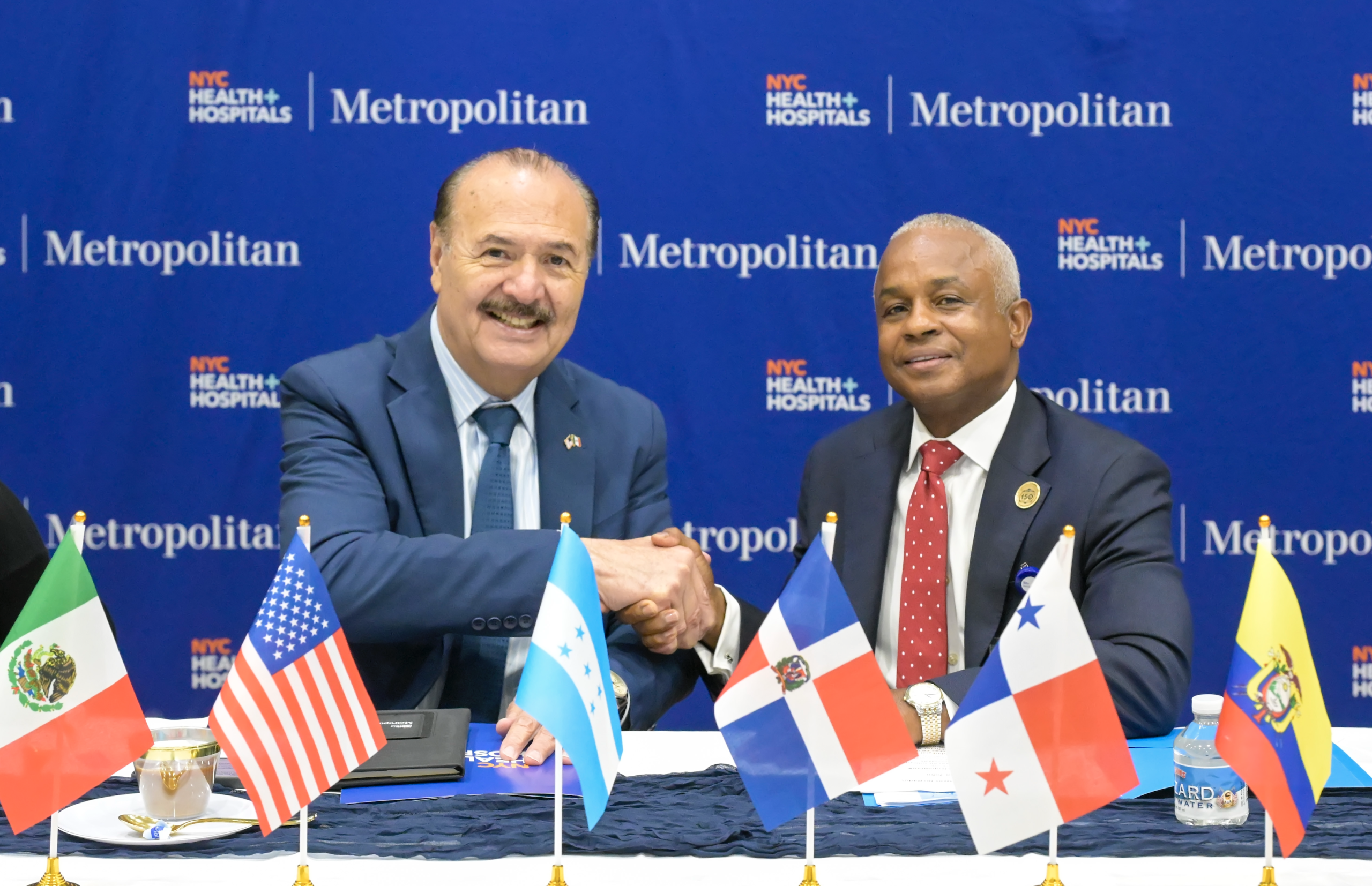 From left, Marcos Bucio Mújica, Consul General of Mexico in New York, and Julian John, CEO of NYC Health + Hospitals/Metropolitan, shake hands during the 2026 Met Nation Summit. Photo by Damien Kim for Metropolitan Hospital.