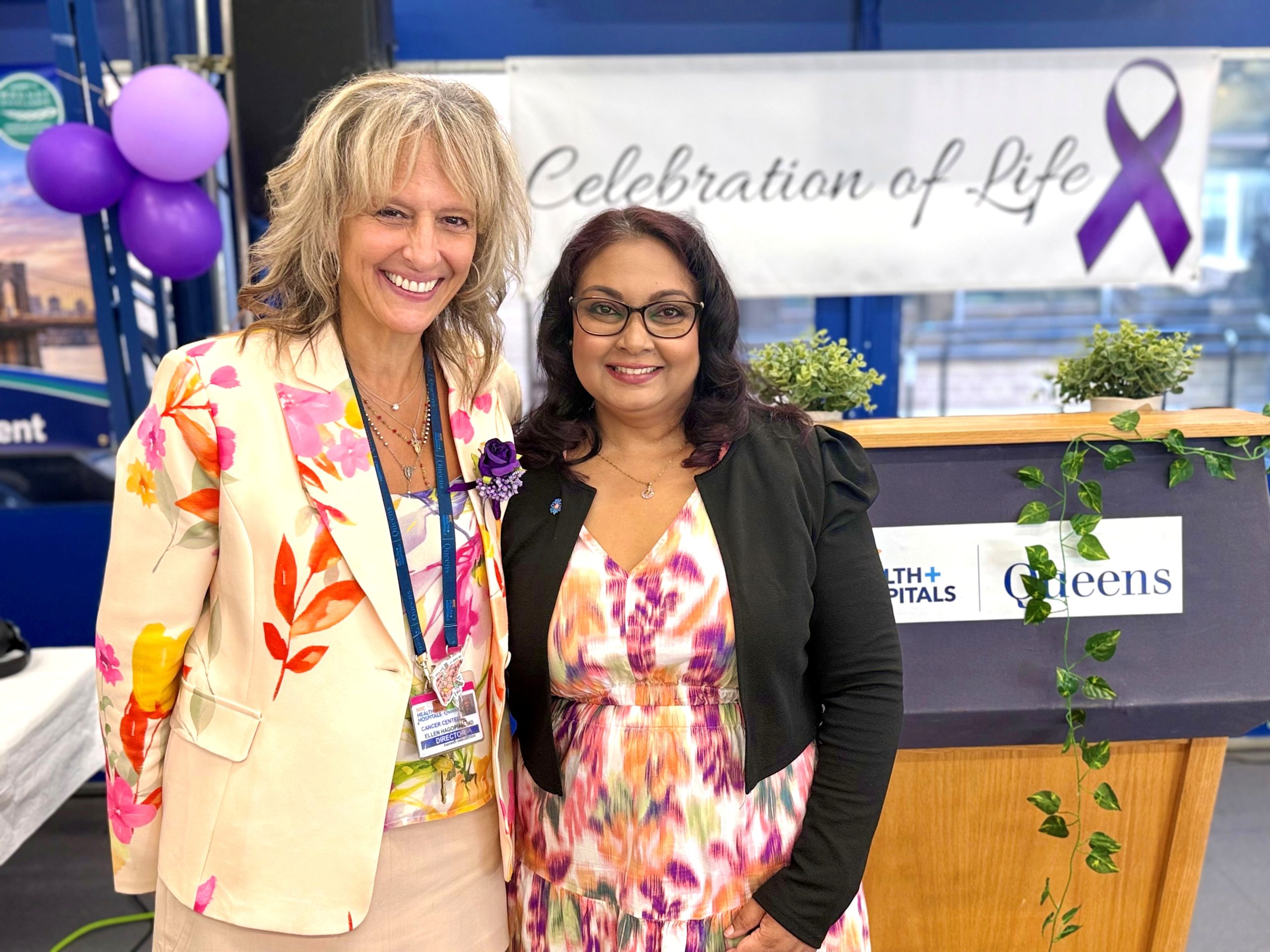Dr. Ellen Hagopian, Director of the Queens Cancer Center (left), with a cancer survivor and patient of NYC Health + Hospitals/Queens who delivered an inspirational keynote address during the Annual Celebration of Life event. The event honored the journeys of cancer survivors and celebrated the strength and resilience of the community.