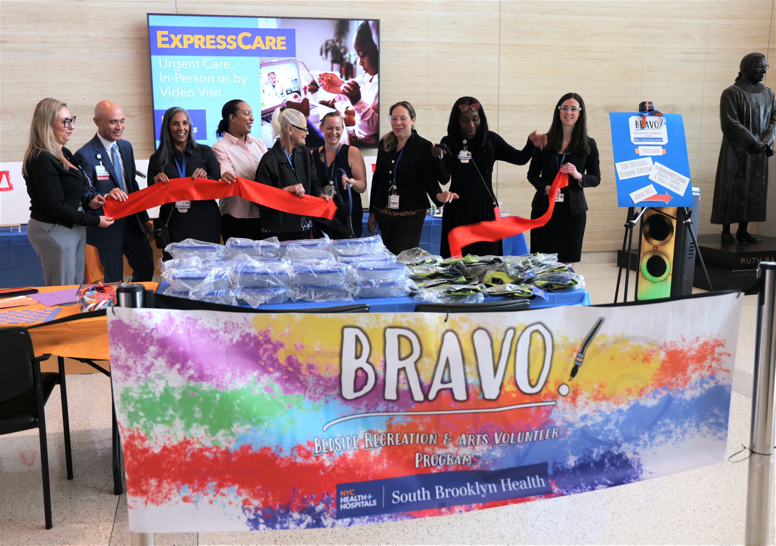 Celebrating the new BRAVO program at South Brooklyn Health. From left to right: Wilfredo Yap, Chief Nursing Officer; Diahann Singh, Chief Quality Officer; Arielle Archibald, MD, Stroke Coordinator; Theresa Scavo, CAB Chair; Julianne Rich, Director of Volunteer Services; Mary Maldonado, Chief Human Resources Officer; Selwena Brewster, MD, Chief Medical Officer; and Riana Freedman, BRAVO Program Director.