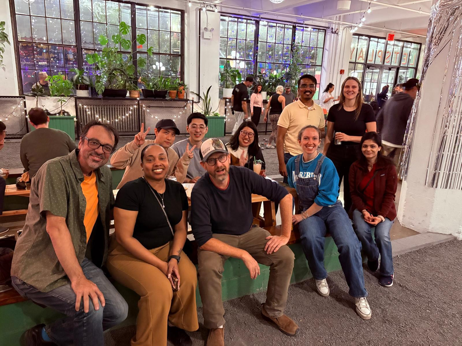 A group of people sitting on a bench
AI-generated content may be incorrect.