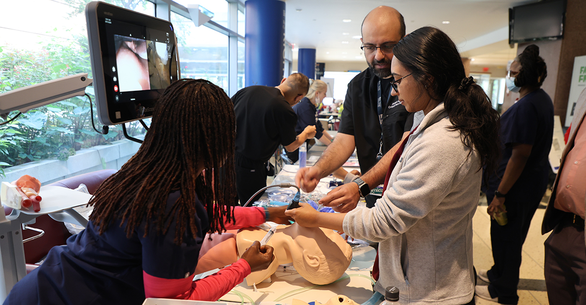 Staff participate in hands-on simulation training during Healthcare Simulation Week at NYC Health + Hospitals/Kings County.