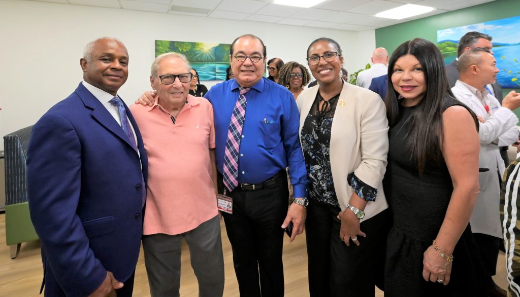Metropolitan Hospital CEO Julian John and COO Elsa Cosme join Auxiliary President Betsy Mendez-White and Auxiliary members to celebrate the opening of the new Serenity Room. Photo by Damien Kim.