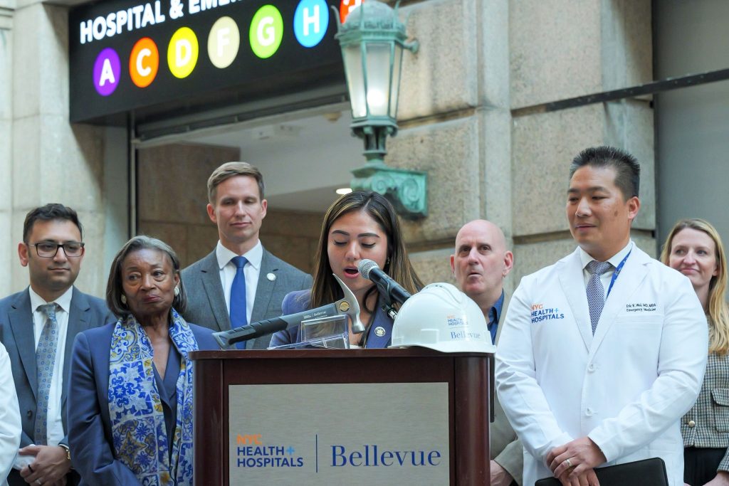 New York State Senator Kristen Gonzalez (center), joined Bellevue Hospital COO Erfan Karim, New York State Senate Majority Leader Andrea Stewart-Cousins, New York State Senator Erik Bottcher, NYC Council Member Harvey Epstein, Bellevue Hospital CEO Dr. Eric Wei, and NYC Council Member Virginia Maloney at the announcement of a $5 million New York State Senate investment to expand child & adolescent psychiatric inpatient care at Bellevue Hospital.