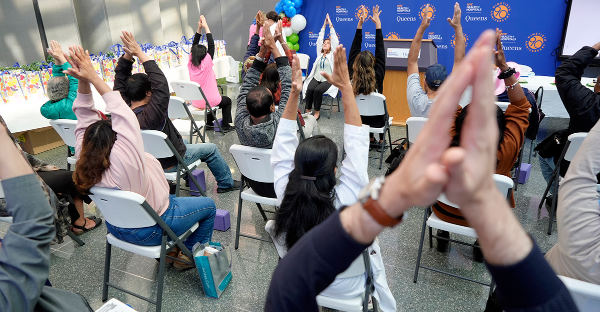 Movement as medicine: Dr. Leia Stathakos, Director of the Weight Management and Healthy Lifestyles Program, leads an incredible chair yoga demonstration for community members during the “Move & Nourish” event at NYC Health + Hospitals/Queens.